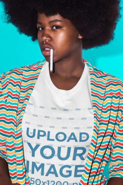 Tee Mockup Featuring a Portrait of a Woman with a Cigarette and Afro Hair Against a Vivid Cyan Background
