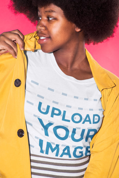 T-Shirt Mockup Featuring a Woman In Front of a Hot Pink Background