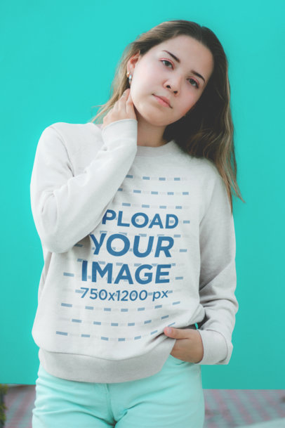 Crewneck Sweatshirt Mockup Featuring a Woman wearing Cyan Colored Pants 18421