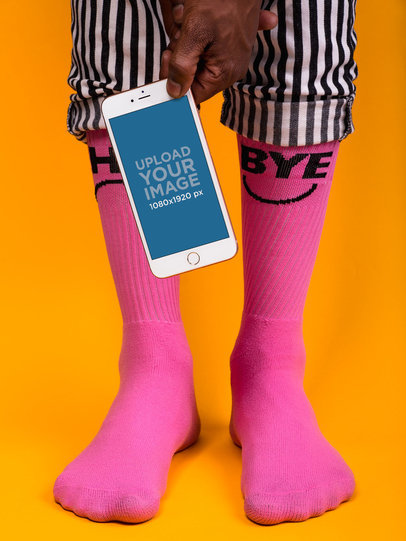 iPhone 8 Mockup Held by Someone Wearing Hot Pink Socks 22086