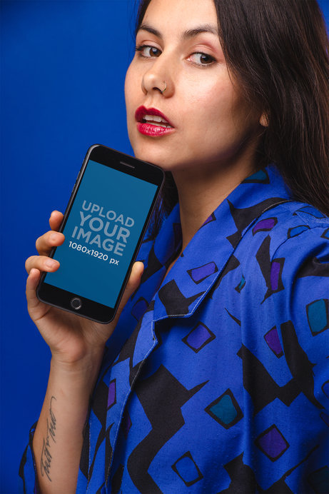 iPhone 8 Plus Mockup Featuring a Woman Wearing Blue