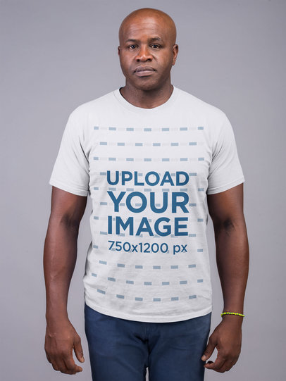 Mockup of a Serious Man Wearing a T-Shirt and Jeans 