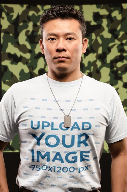 T-Shirt Mockup of a Veteran Man in Front of a Camouflage Background