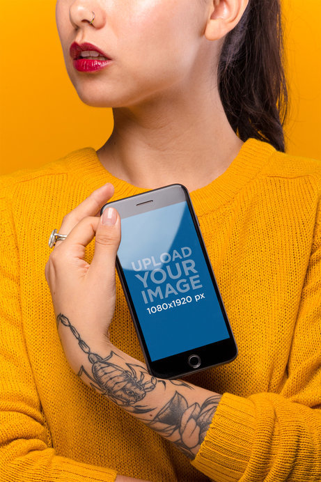iPhone 8 Plus Mockup Featuring a Woman with Tattoos