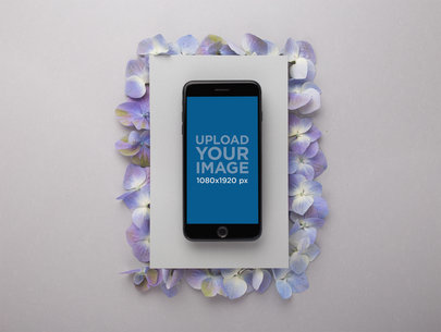 Space Gray iPhone 8 Plus Mockup Lying on a Cardboard Over Purple Petals