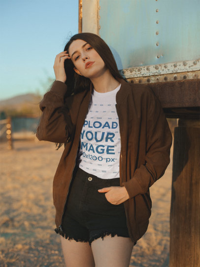 T-Shirt Mockup of a Woman Wearing an Over-Sized Brown Jacket