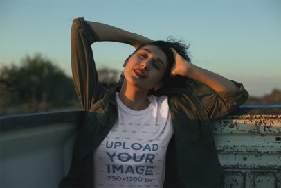 Mockup of a Woman Wearing a T-Shirt Enjoying the Wind