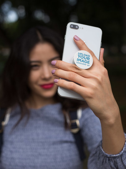 Phone Grip Mockup Featuring a Smiling Girl Taking a Selfie 22064