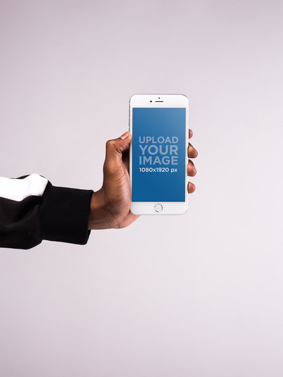 Mockup of an iPhone Held Against a White Surface
