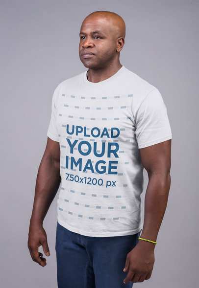 Mockup Featuring a Serious-Looking Man Wearing a T Shirt Against a Flat Background