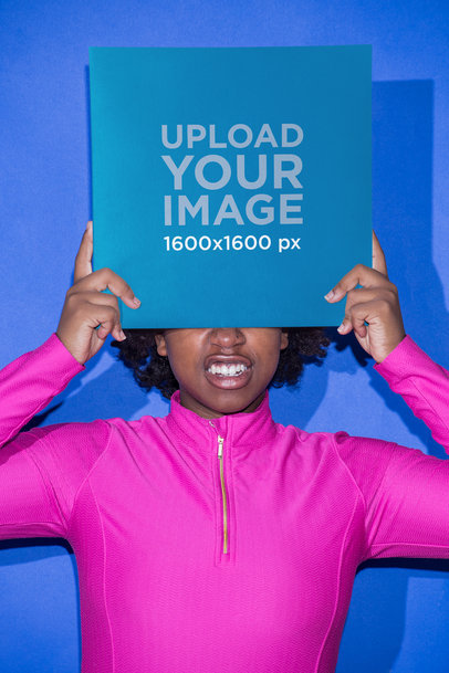 Vinyl Album Cover Mockup Featuring a Girl with a Hot Pink Zip Top Against an Azure Wall 22111