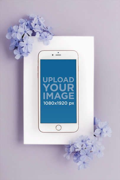 Mockup of an iPhone Lying on a Surface Decorated with Hydrangeas 22137