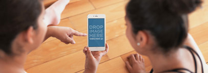 Mockup Template of Girls Using White iPhone 6 During Ballet Class