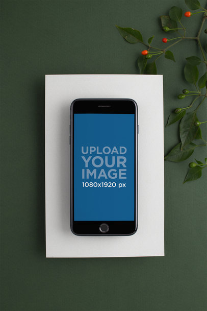 Space Gray iPhone 8 Plus Mockup Lying on a Dark Green Background with Green Leaves 22138