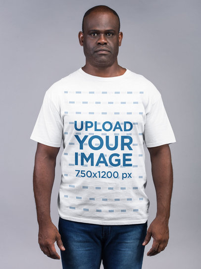 Mockup Featuring a Man Wearing T-Shirt and Jeans with a Serious Expression