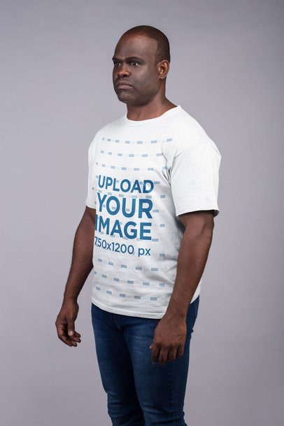 T-Shirt Mockup of a Serious Man With His Arms by His Side