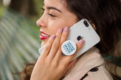 Phone Grip Mockup Held by a Woman Talking on the Phone