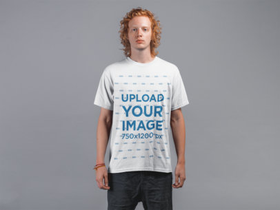 Round Neck Tee Mockup of a Young Man with Red Hair Against Gray Wall 