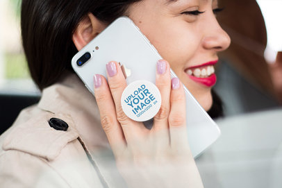 Phone Grip Mockup Featuring a Smiling Woman Making a Phone Call with an iPhone 