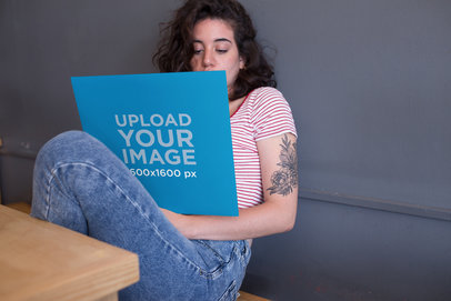 Mockup Featuring a Girl Looking at a Vinyl Record Cover 22102