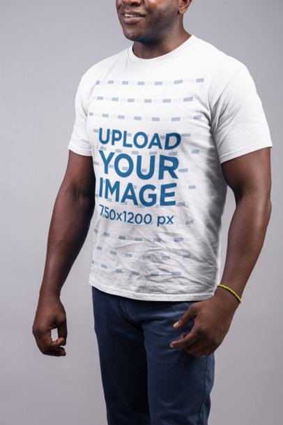 Mockup of a Smiling Man Wearing a T Shirt and Blue Trousers