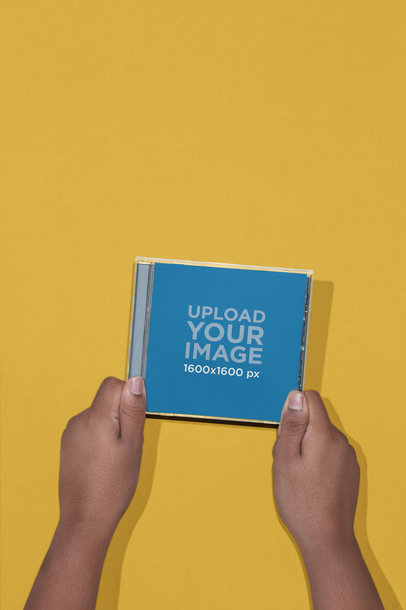 CD Mockup Held by Two Hands