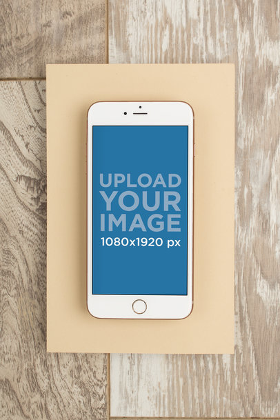 Gold iPhone 8 Mockup over a Wooden Background