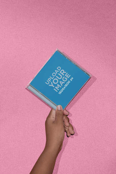 Mockup of a CD Cover in Front of a Solid Background