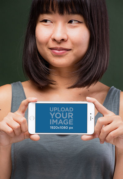 iPhone 8 Plus Mockup Held Horizontally by a Woman