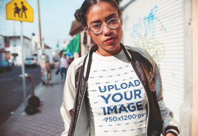 T-Shirt Mockup Featuring a Woman Wearing Clear Glasses
