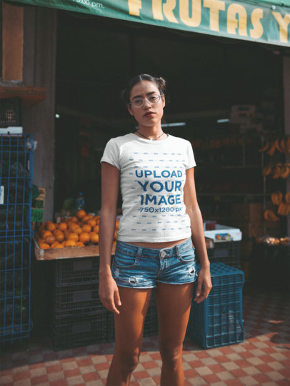 T Shirt Mockup Featuring a Woman in Denim Shorts Outside a Street Food Market 