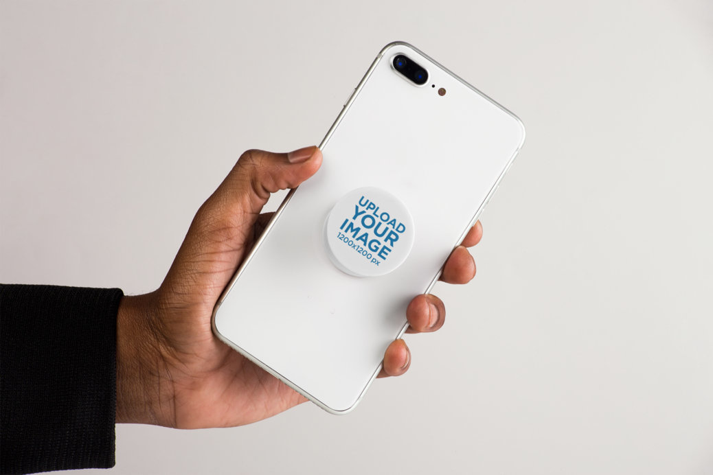 Mockup Featuring a Male Hand Showing an iPhone with a Phone Grip