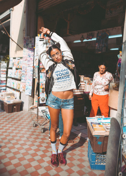 T Shirt Mockup of a Woman Posing in an Urban Street Style Outside a Book Store