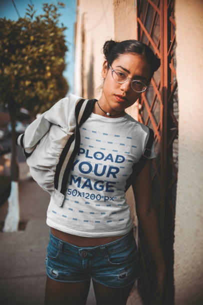 T-Shirt Mockup of a Woman With Her Jacket Draped Over Her Shoulder