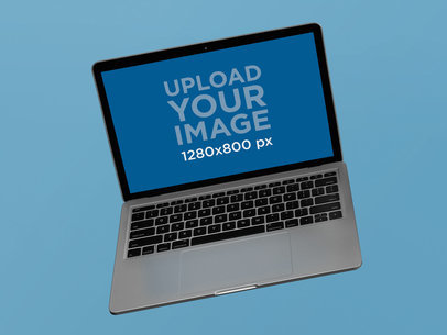 Floating MacBook Pro Mockup Against a Solid Background 