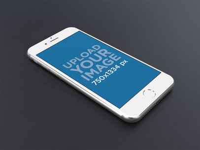 Silver iPhone 8 Mockup Resting on a Black Surface