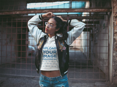 Mockup of a Woman Wearing a T-Shirt Adjusting Her Pigtails