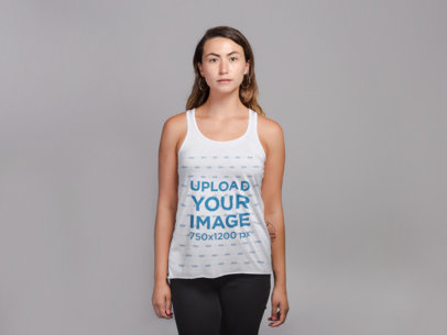 Tank Top Mockup Featuring a Woman with Jeans Against a Flat Wall 21302