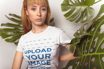 T-Shirt Mockup of a Woman Surrounded by Leaves