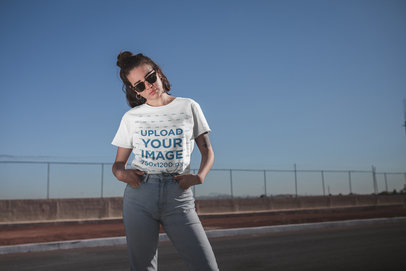 Mockup of a Woman Wearing a T-Shirt and High-Waisted Jeans
