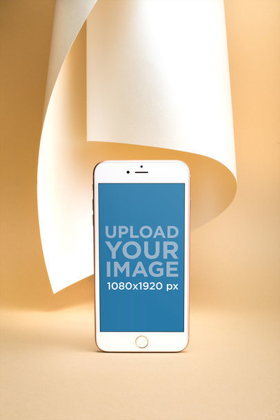 Gold iPhone 8 Plus Mockup Standing Against an Artistic Background 