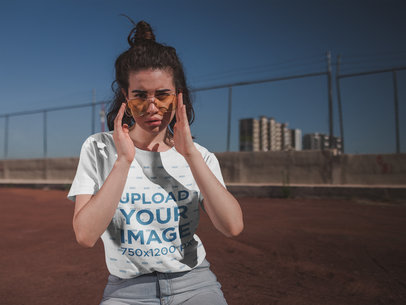 T-Shirt Mockup of a Woman Looking Over Her Glasses