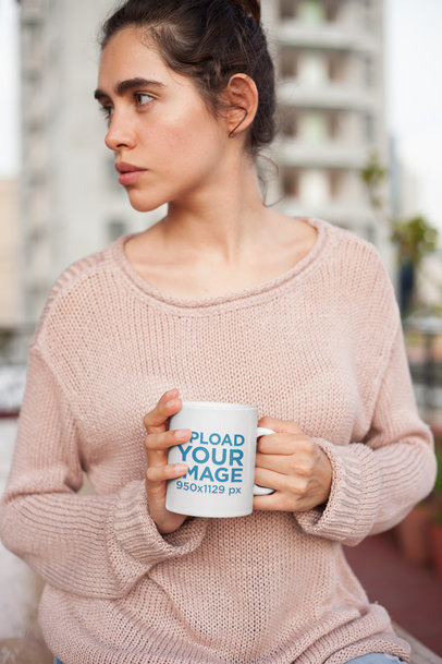 Mockup of a Woman Holding a Coffee Cup Wearing a Knit Sweater 22437