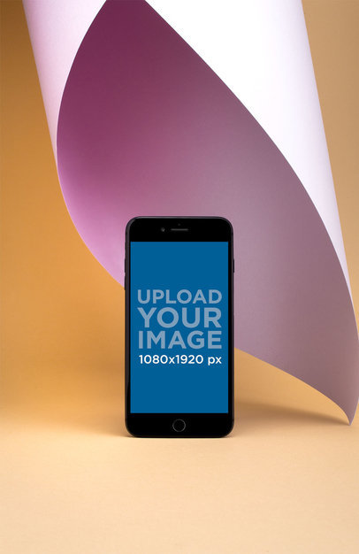 iPhone 8 Plus Mockup Standing Over a Solid Yellow Surface