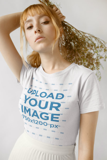 T-Shirt Mockup Featuring a Woman With Her Hair Tied Into a Loose Ponytail 18381