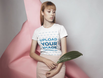 T Shirt Mockup of a Woman Against Abstract Cardboard Art