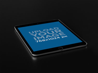 Space Gray iPad Mockup Lying on a Black Background 