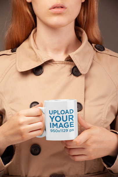 Coffee Mug Mockup Held by a Woman Wearing a Trench Coat