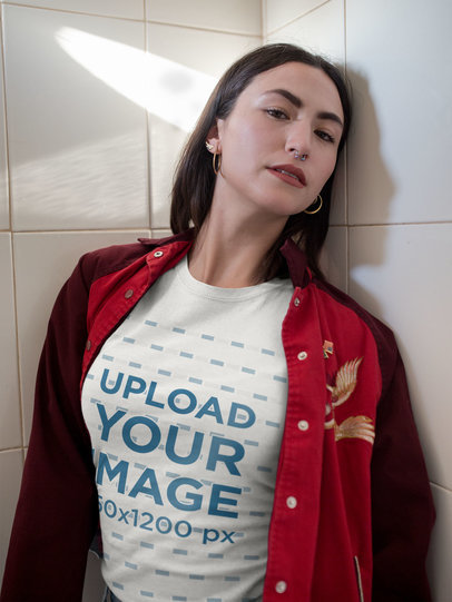 T-Shirt Mockup of a Woman Leaning on a Tile Wall