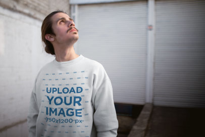 Mockup of a Man Wearing a Sweatshirt While Staring at the Sky